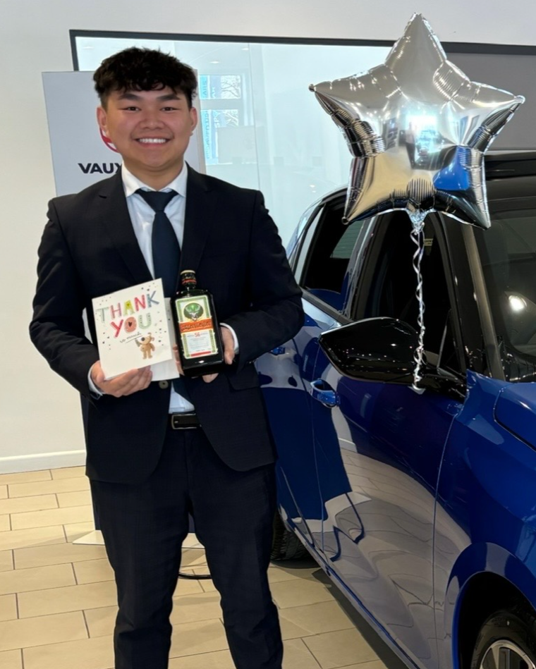 Wilson Ng, founder of ForecourtIQ, on the dealership showroom floor